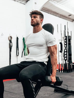 White performance fit raglan sleeve tee with crew neck and short sleeves.