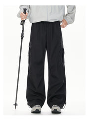 Men's black cargo sweatpants with relaxed fit and adjustable drawstring hem.
