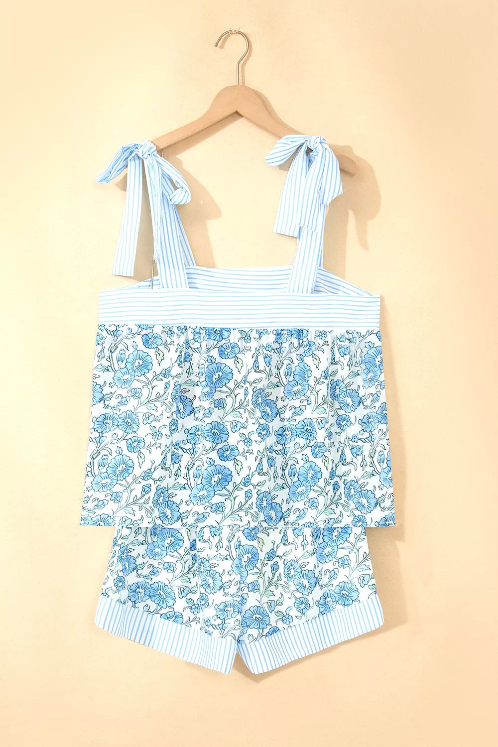 Floral print cami top and shorts set with adjustable tie straps and blue stripes.