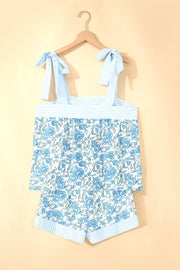 Floral print cami top and shorts set with adjustable tie straps and blue stripes.