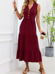 Burgundy tiered midi dress with V-neck and decorative buttons.