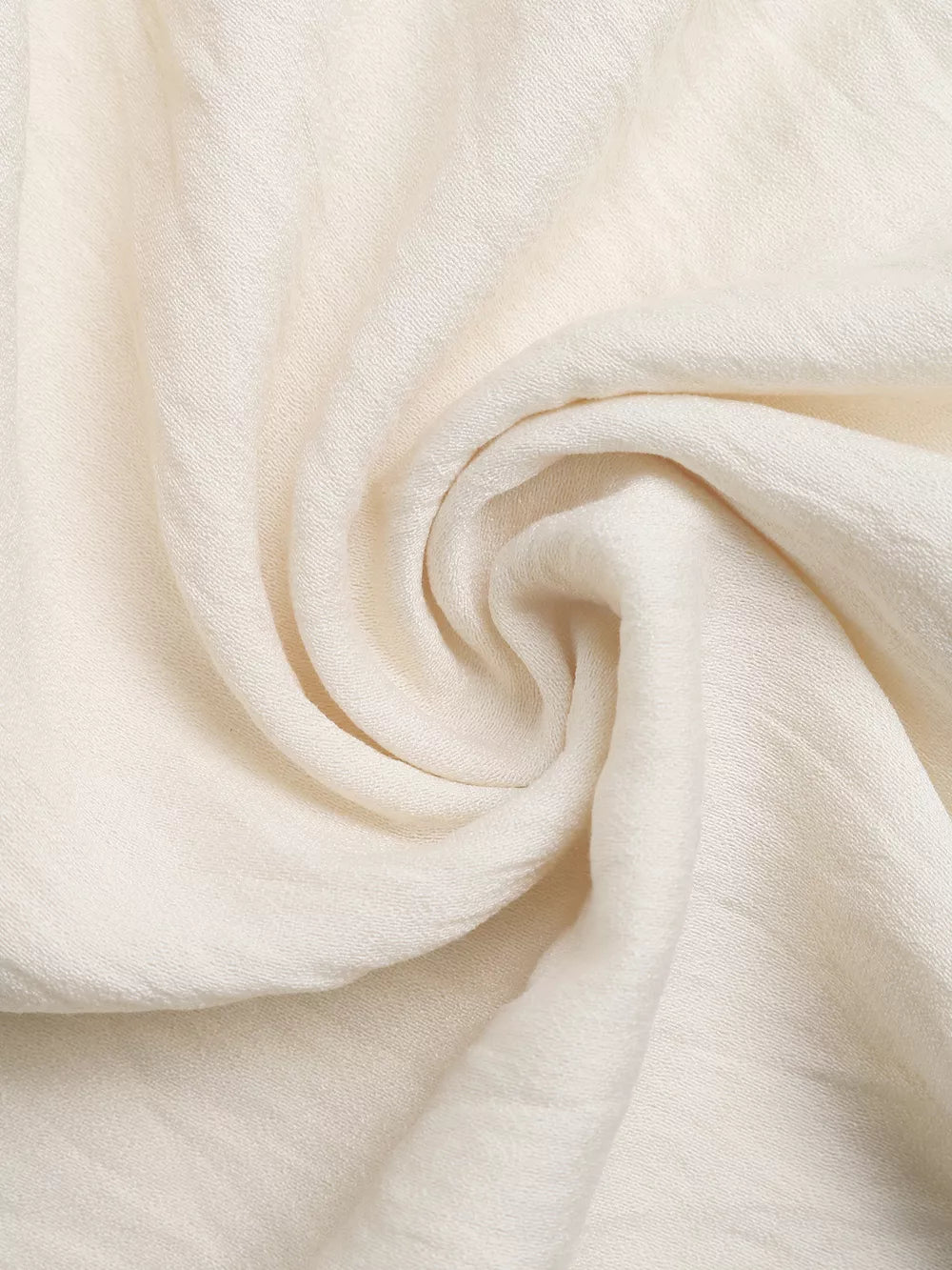 Bohemian halter maxi dress fabric detail, off-white textured linen blend.