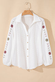White embroidered eyelet blouse with poet sleeves and star details