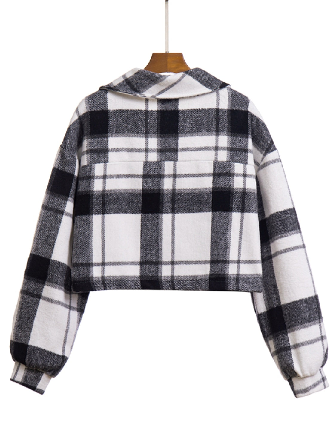 Chic plaid jacket in black and white with buttoned front and chest pocket.