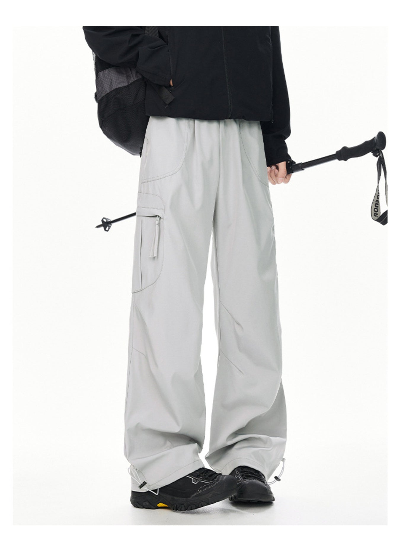 Men's light gray relaxed fit cargo sweatpants with adjustable drawstring ankles.