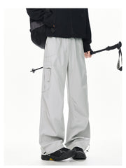 Men's light gray relaxed fit cargo sweatpants with adjustable drawstring ankles.