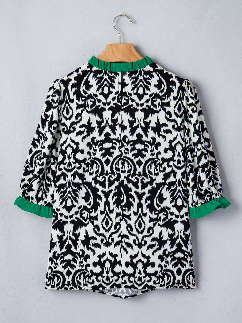 Damask print maternity blouse with green ruffled collar and cuffs, half sleeves.