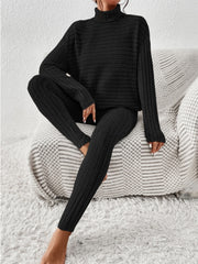 Black ribbed turtleneck lounge set with long sleeves and matching leggings.