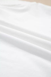 White cotton maternity t-shirt with delicate eyelet detail and flutter sleeves.