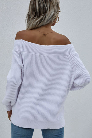 White ribbed knit sweater with off-the-shoulder boatneck and puff sleeves.
