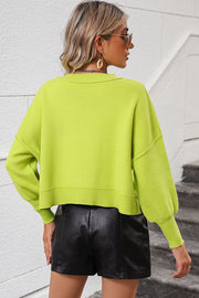Neon Yellow-Green cropped knit sweater with dolman sleeves and ribbed details.