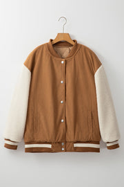 Corduroy bomber jacket in Terracotta with sherpa sleeves and striped ribbed trim.