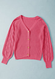 Hot pink diamond-cut sleeve knit cardigan with button front and V-neck.