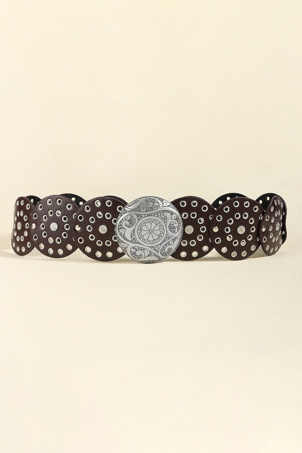 Disc-embellished statement belt in silver/coffee with a large, ornate silver buckle.