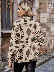 Tan Aztec sherpa zip-up jacket with a mock neck and tribal print.