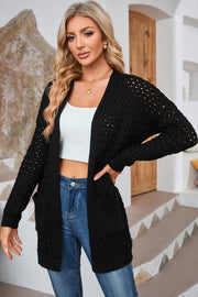 Black open-knit pocket cardigan with textured diamond pattern and long sleeves.