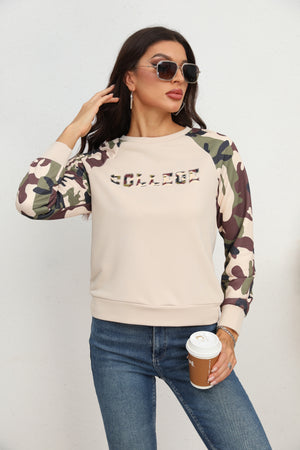 Cream crewneck sweatshirt with camouflage raglan sleeves and "COLLEGE" graphic.