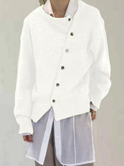 White asymmetric button-up knit cardigan with dark buttons and ribbed cuffs.