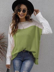 Colorblock crewneck knit sweater in lime green, cream, and white with side slits.