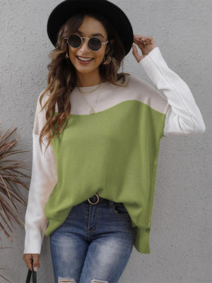 Colorblock crewneck knit sweater in lime green, cream, and white with side slits.