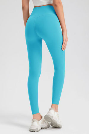 Light Blue high-waist leggings with V-seam detail, full length, athletic fit.