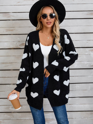 Black acrylic cardigan with white intarsia hearts, open front, long sleeves