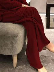 Burgundy ribbed knit sweater ensemble with wide-leg pants.