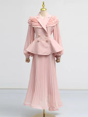 Pink skirt suit with frill collar, balloon sleeves, peplum waist, and pleated skirt.