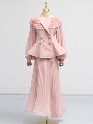 Pink skirt suit with frill collar, balloon sleeves, peplum waist, and pleated skirt.