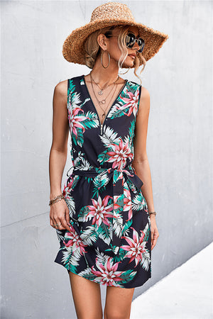 Black floral zip-front mini dress with tie waist and v-neckline