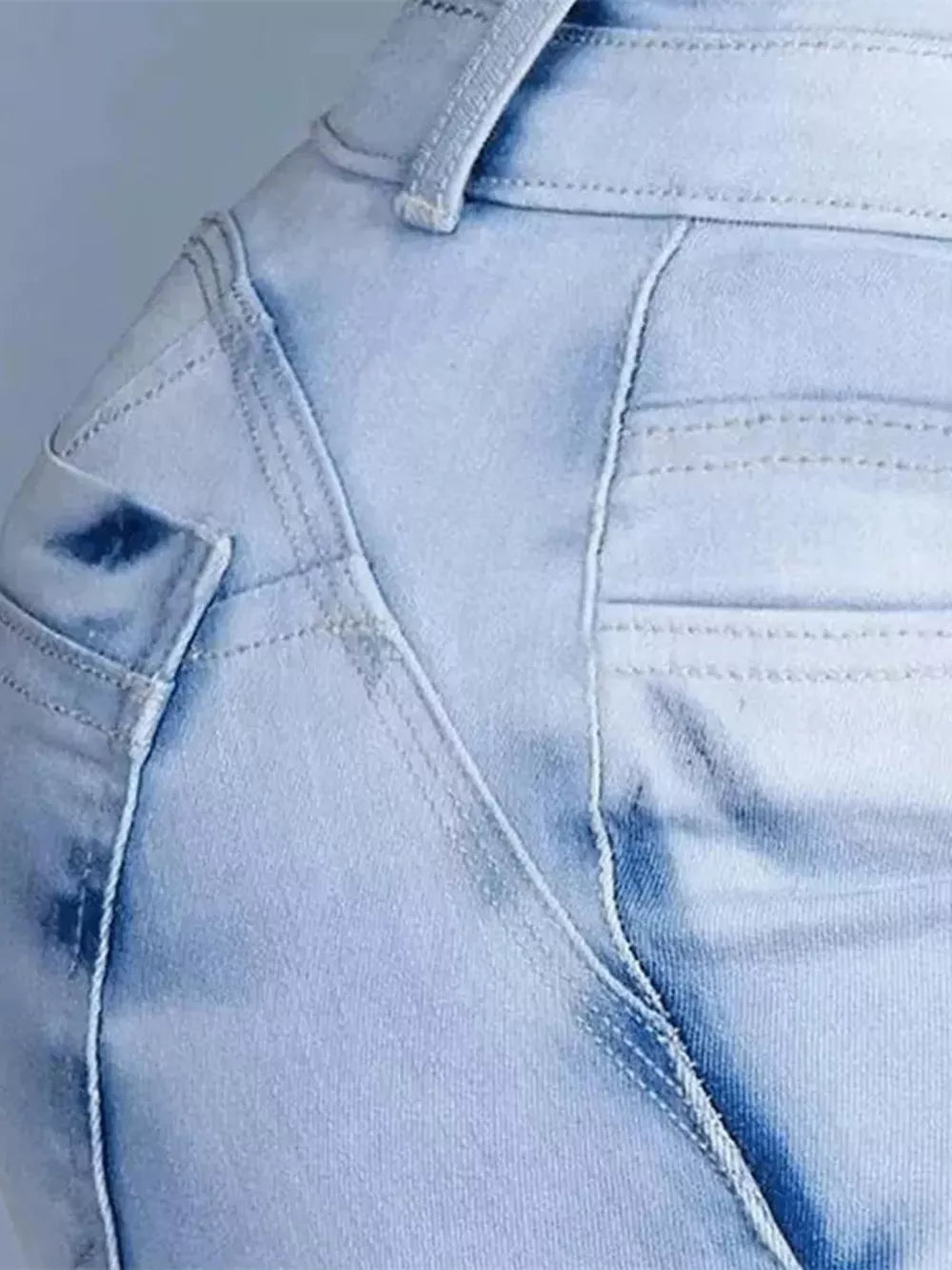 Light blue wash cotton spandex jeans with high waist and pocket detail.