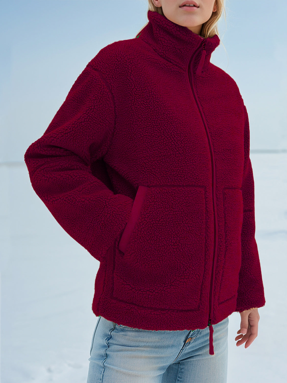 Burgundy sherpa jacket with stand collar, zip front, and two patch pockets.