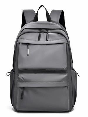 Gray urban commuter backpack with multiple exterior zip pockets and padded straps.