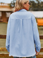 Misty Blue overshirt with frayed hem and button cuffs.