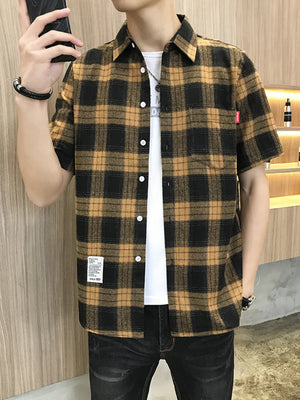 Classic oversized plaid short sleeve shirt in yellow and black cotton, button-down style.