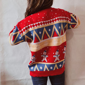 Red acrylic knit jumper with gingerbread men and geometric pattern.
