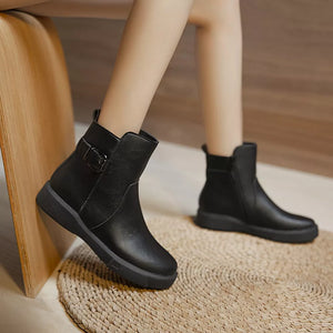 Chic black round toe platform ankle boots with decorative buckle detail