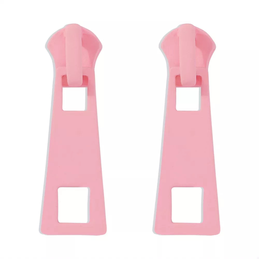 Pink zipper drop earrings with square cutouts and alloy material.