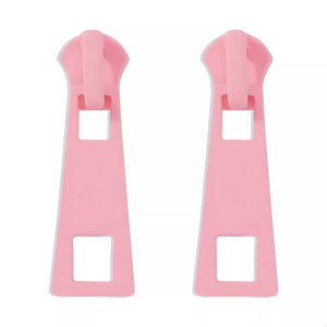 Pink zipper drop earrings with square cutouts and alloy material.