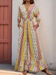 Bohemian print palazzo jumpsuit with V-neck, smocked waist, and wide legs in multicolor.