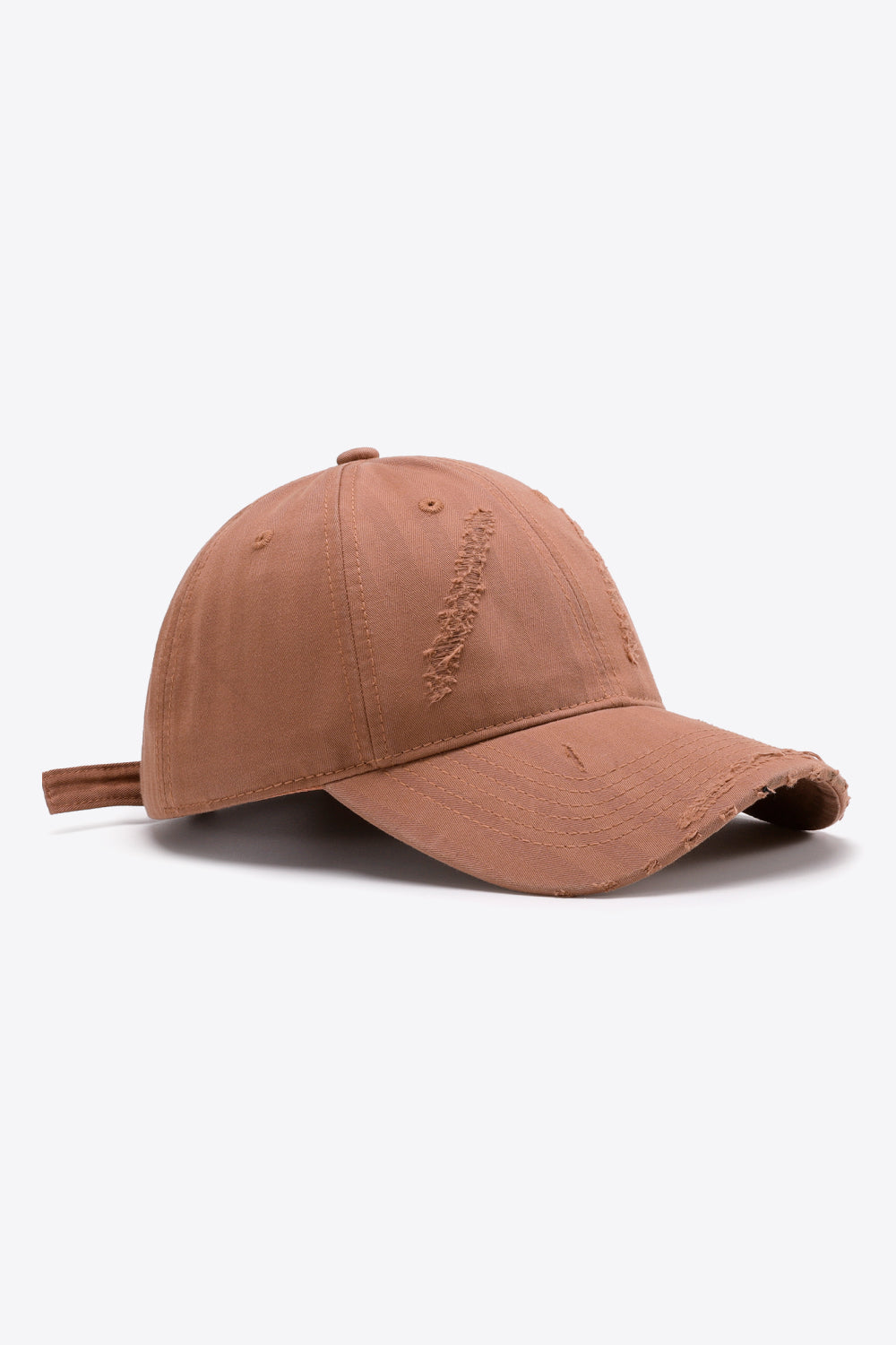 Distressed baseball cap in coral with adjustable strap and frayed details