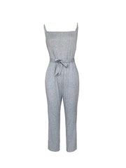 Sleeveless gray jersey jumpsuit with tie-waist and square neckline.