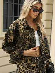 Leopard print denim jacket with button front and chest pockets.