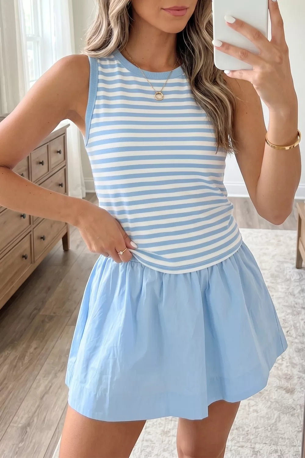 Two-piece set with blue and white striped tank top and light blue skort