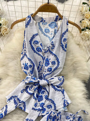 Blue floral print halter top with belted detail, polyester, part of a two-piece set.