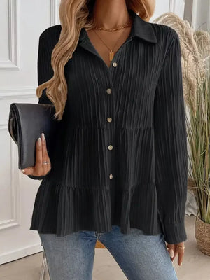 Black textured tiered button-down shirt with crinkled fabric and button details.