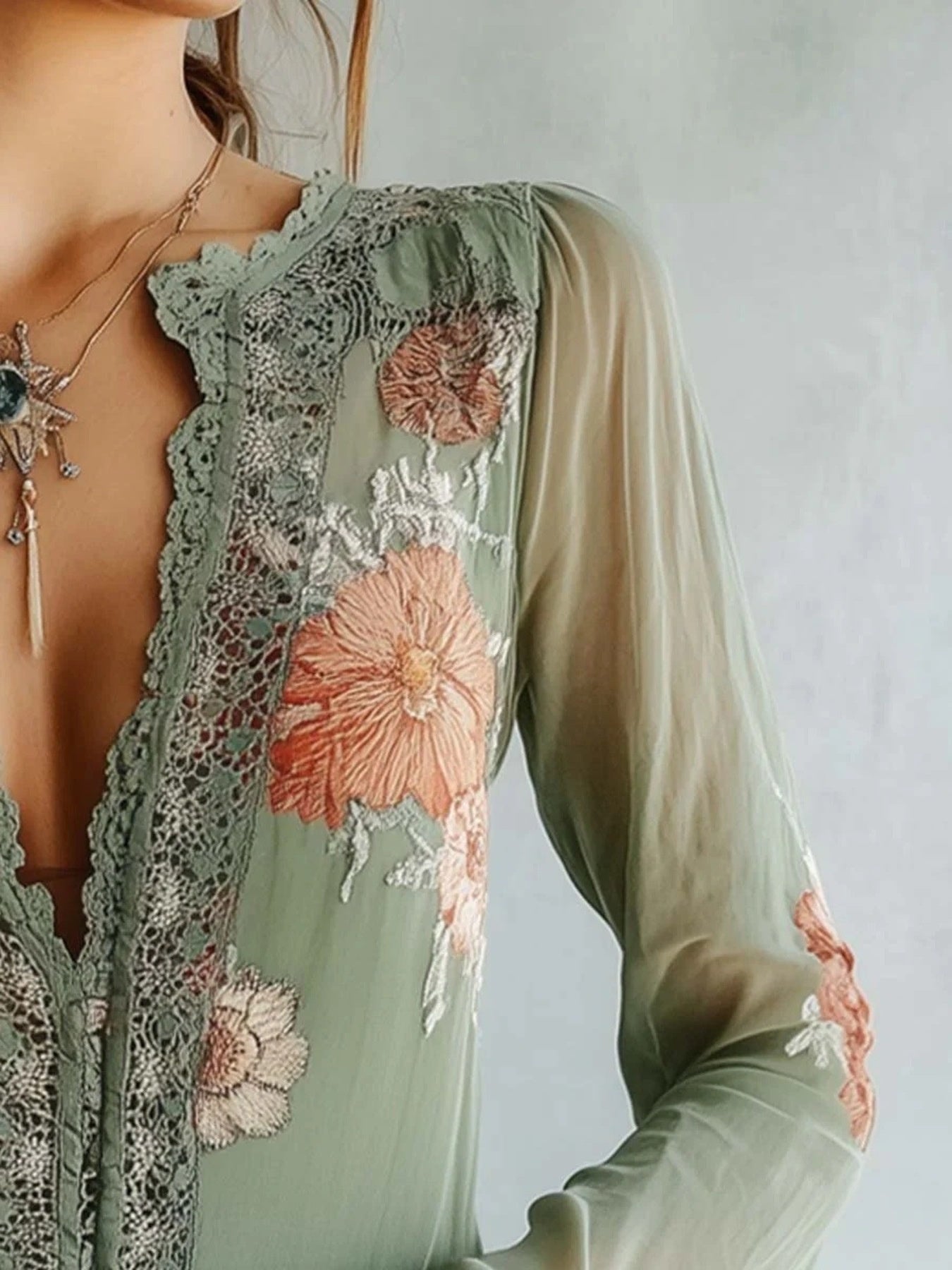 Green floral embroidered lace blouse with deep V-neck and bishop sleeves