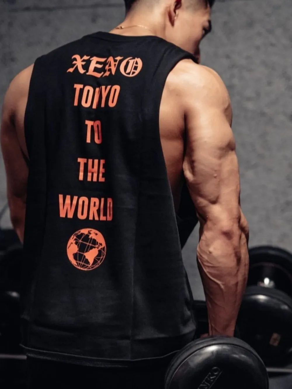 Black graphic muscle tank with orange Xeno Tokyo text and globe graphic.
