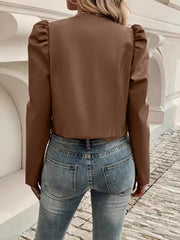Caramel vegan leather bolero jacket with puffed shoulders and long sleeves.