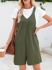 Moss textured romper with gathered yoke and pockets, styled with a white tee.